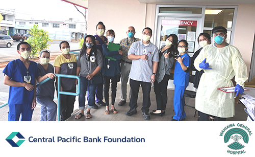 A group of healthcare workers and community members wearing face masks pose outside a hospital emergency department entrance. Central Pacific Bank Foundation and Wahiawā General Hospital logos are displayed along the bottom of the image.