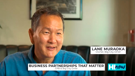 A person in a blue shirt is featured in an interview setting, with on-screen text reading “Business Partnerships That Matter” and identifying the person as the owner of Big City Diner.