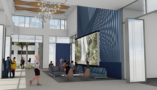 A modern building lobby rendering featuring high ceilings, lounge seating, large windows, decorative lighting, and a digital display wall, with people gathered throughout the open space.  Provide your feedback on BizChat