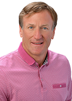 A professional headshot of a person wearing a pink patterned collared shirt, photographed against a white background.