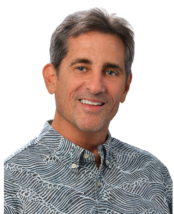 A professional headshot of a person wearing a gray patterned aloha shirt, photographed against a plain white background.